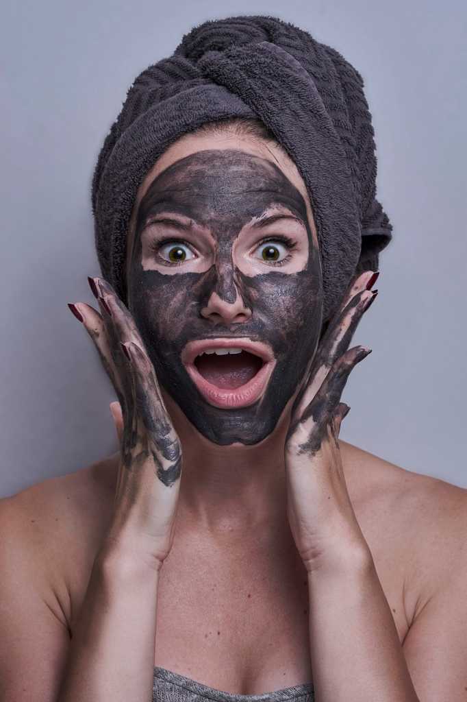 Woman wearing a charcoal face mask